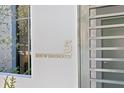 Building address plaque at the entrance of unit 5 at 3020 W Santiago St # 5, Tampa, FL 33629