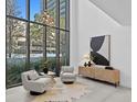 Bright and airy sitting area with large windows and city views at 3020 W Santiago St # 5, Tampa, FL 33629