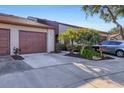Charming home featuring a well-maintained front yard with colorful foliage and a private garage at 4542 Park Lake N Ter # 4542, Bradenton, FL 34209