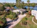 Bird's eye view of a house near a lake at 10649 Blossom Lake Dr, Seminole, FL 33772