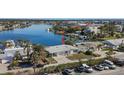 Aerial view of waterfront home with boat slips and access to the marina at 17163 2Nd E St, North Redington Beach, FL 33708