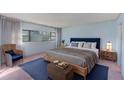 Spacious bedroom with light blue walls and a king-size bed at 30 Turner St # 201, Clearwater, FL 33756