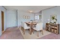 Bright dining room with light walls and wooden table at 30 Turner St # 201, Clearwater, FL 33756