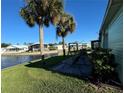 Backyard patio with seating area overlooking a canal at 35127 Danny Dr, Zephyrhills, FL 33541
