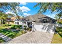 Two-story house with a pool and fenced backyard at 7023 Derwent Glen Cir, Land O Lakes, FL 34637