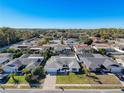 Wide shot of the neighborhood, highlighting the subject home and pool at 8015 Idlebriar Ln, Port Richey, FL 34668