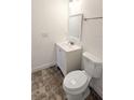 Updated bathroom with white vanity and tiled floor at 9060 Moonlit Meadows Loop, Riverview, FL 33578