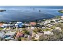 Waterfront property, showcasing a beautiful home and neighborhood at 209 Westwinds Dr, Palm Harbor, FL 34683