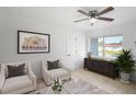 Bright living room featuring neutral decor and ample natural light at 3414 W Louisiana Ave, Tampa, FL 33614