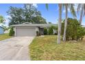 Front view of a single-story house with gray siding at 3707 66Th W St, Bradenton, FL 34209