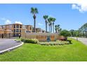 Beachwalk community entrance with lush landscaping and signage at 4307 Bayside Village Dr # 202, Tampa, FL 33615