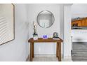 Bright entryway featuring a decorative glass front door visible in the mirror, neutral decor, and a console table at 6366 38Th N Ave, St Petersburg, FL 33710