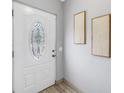 Bright entryway featuring a decorative glass front door, neutral wall decor, and tiled flooring for a welcoming ambiance at 6366 38Th N Ave, St Petersburg, FL 33710