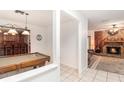 View of game room, wet bar, and a glimpse of a stone fireplace at 6411 Sunhigh Dr, New Port Richey, FL 34655