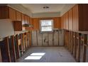 Kitchen undergoing renovation, showcasing exposed framing at 7028 Southwind Dr, Hudson, FL 34667