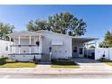 Nice curb appeal, featuring a covered porch and carport at 8346 Fantasia Park Way, Riverview, FL 33578