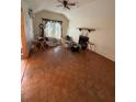 Large main bedroom with hardwood floors and a fireplace at 10296 Horizon Dr, Spring Hill, FL 34608