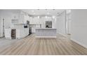Modern kitchen featuring white cabinets, a large island, and stainless steel appliances at 200 W Kirby St, Tampa, FL 33604