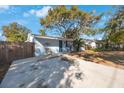 Newly renovated light blue house with a long driveway at 3612 Phillips St, Tampa, FL 33619