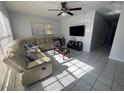 Bright living room with sectional sofa and tile floor at 400 Alma Dr, Brandon, FL 33510