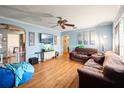 Living room with hardwood floors, light blue walls, and comfortable seating at 7201 Park S St, St Petersburg, FL 33707