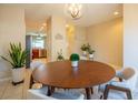 Round dining table with seating for four in a bright room at 12303 Foxmoor Peak Dr, Riverview, FL 33579