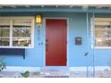 Close-up view of the home's red front door at 4670 Yarmouth S Ave, St Petersburg, FL 33711