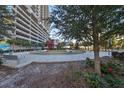 Relaxing courtyard with circular pathway, benches, and landscaping at 1208 E Kennedy Blvd # 725, Tampa, FL 33602