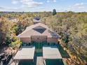 Aerial view of condo building, showing two-story units with covered parking at 1901 Lennox E Rd # 1901, Palm Harbor, FL 34683