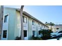 Side view of the building, highlighting its design and setting at 20853 Haulover Cv # A8, Lutz, FL 33558