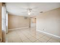 Spacious living room with tile flooring and ceiling fan at 3529 Windham Dr, Holiday, FL 34691