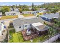 Aerial view of a well-maintained home featuring a wooden deck and backyard at 3529 Windham Dr, Holiday, FL 34691