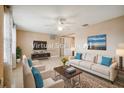 Bright living room with neutral colors, modern furniture, and a ceiling fan at 3529 Windham Dr, Holiday, FL 34691