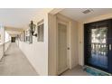 Residential hallway with access to condo units at 147 Bluff View Dr # 204, Belleair Bluffs, FL 33770