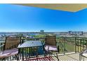 Enjoy panoramic views from this balcony featuring a table and chairs, perfect for relaxing and entertaining guests at 501 Haben Blvd # 806, Palmetto, FL 34221