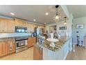 Well-equipped kitchen boasts granite countertops, stainless steel appliances, and ample cabinet space at 501 Haben Blvd # 806, Palmetto, FL 34221