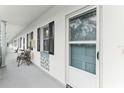 Building hallway with access to individual units at 100 Glennes Ln # 108, Dunedin, FL 34698