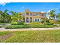 Beautiful two-story home featuring lush landscaping, a barrel tile roof, and a Mediterranean architectural style at 1925 Beach Se Dr, St Petersburg, FL 33705