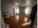 Large bedroom with laminate wood flooring and ample natural light at 2161 Aqui Esta Dr, Punta Gorda, FL 33950