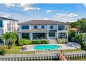 Luxury waterfront home with pool, dock and expansive backyard at 5120 W Longfellow Ave, Tampa, FL 33629