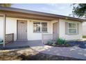 Front entrance with a walkway and landscaping at 10947 109Th Way, Largo, FL 33778