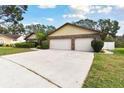 Three-car garage and large driveway at 1121 Belladonna Dr, Brandon, FL 33510