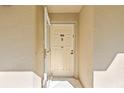 Front door entry to condo with security screen door at 1247 S Martin Luther King Jr Ave # 107, Clearwater, FL 33756