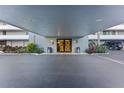 Covered entrance to a building with parking and landscaping at 201 W Laurel St # 503, Tampa, FL 33602