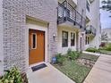 Private entrance to townhouse with brick facade and landscaping at 2511 N Grady N Ave # 59, Tampa, FL 33607