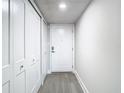 Bright entryway with white closets and wood-look floors at 400 Island Way # 1411, Clearwater Beach, FL 33767