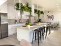 Modern kitchen with island, stainless steel appliances, and white cabinetry at 5516 Golden Dr, Tampa, FL 33634