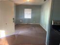 Simple living room with wood floors and carpeted area at 803 W Warren St, Plant City, FL 33563