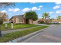 One-story house with a two-car garage and a green lawn at 11240 Ragsdale Ct, New Port Richey, FL 34654