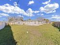 Backyard view showing a spacious grassy area at 14140 E Parsley Dr, Madeira Beach, FL 33708